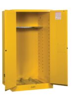 The Justrite Cabinet, Vdrum Flam 55G Man Yl, is painted bright yellow with its doors open, showing an empty interior with one adjustable shelf and a vented base. A small label is placed discreetly inside the doors top right corner.