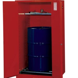 A Justrite Cabinet stands open, displaying a large Vdrum W/Rlr 55G Mn Rd in vibrant blue. Above the drum, a shelf holds several neatly organized small tools or equipment.