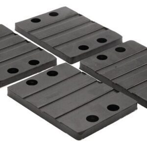 Four rectangular black Justrite Chock,Ac,Acc,6856,Rpad rubber mats with grooves and a grid of four holes are displayed on a light gray background, offering functionality and sleek aesthetics.