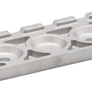 The Justrite Chock,At,Acc,3512,Clt boasts a sleek rectangular silver metal design with three circular indents at the center. Its angular sides and small rectangular top-edge accents add modernity to this functional piece.