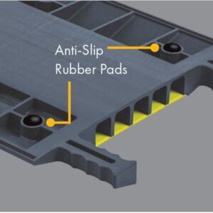 Close-up of Justrite Cp,Acc,Rpad Kit,1,8Pk gray modular panel features anti-slip rubber pads and yellow hollow compartments. Edges have serrated grips for safety.