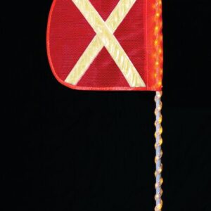 The Justrite Whip,Ap,Led,A,3,Of,Yx,A features a vibrant red triangular flag with a reflective yellow X on a pole wrapped in LED lights. An illuminated bulb at the top enhances the vivid colors and LED glow against the black backdrop.