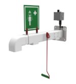 The Justrite H Wall-Mounted Emergency Shower includes a green sign with a figure under water sprays, medical cross, red pull lever, and attached control box for 1H access. It is affixed to a white pipe.
