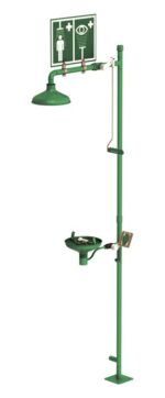 The Justrite H Combshwr in green is essential for labs, featuring an Opn Ss Bowl on a vertical pole with a showerhead and an eyewash basin labeled for eye and body safety.