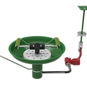 A 3D render shows a green Justrite H,Efwsh,Lb,Tblmt,Opn Ss Bwl,Ss safety shower and eyewash station with chains, foot pedal, piping, showerhead on a vertical pipe, and a red lever.