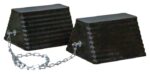 The Justrite Chock (model Rc, 11.5, Pyr, Ch Pr, Blk) consists of two black rubber wheel chocks linked by a metal chain. With a ridged texture and angled design, they securely hold vehicle wheels in place to prevent movement.