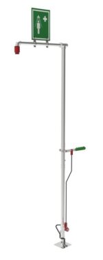 The Justrite H,Shower,Sd,Flr Mnt, Ss is an emergency eyewash station with a tall metal stand, hand lever, and shower nozzle. A green sign featuring a figure and plus symbol ensures quick access during emergencies.