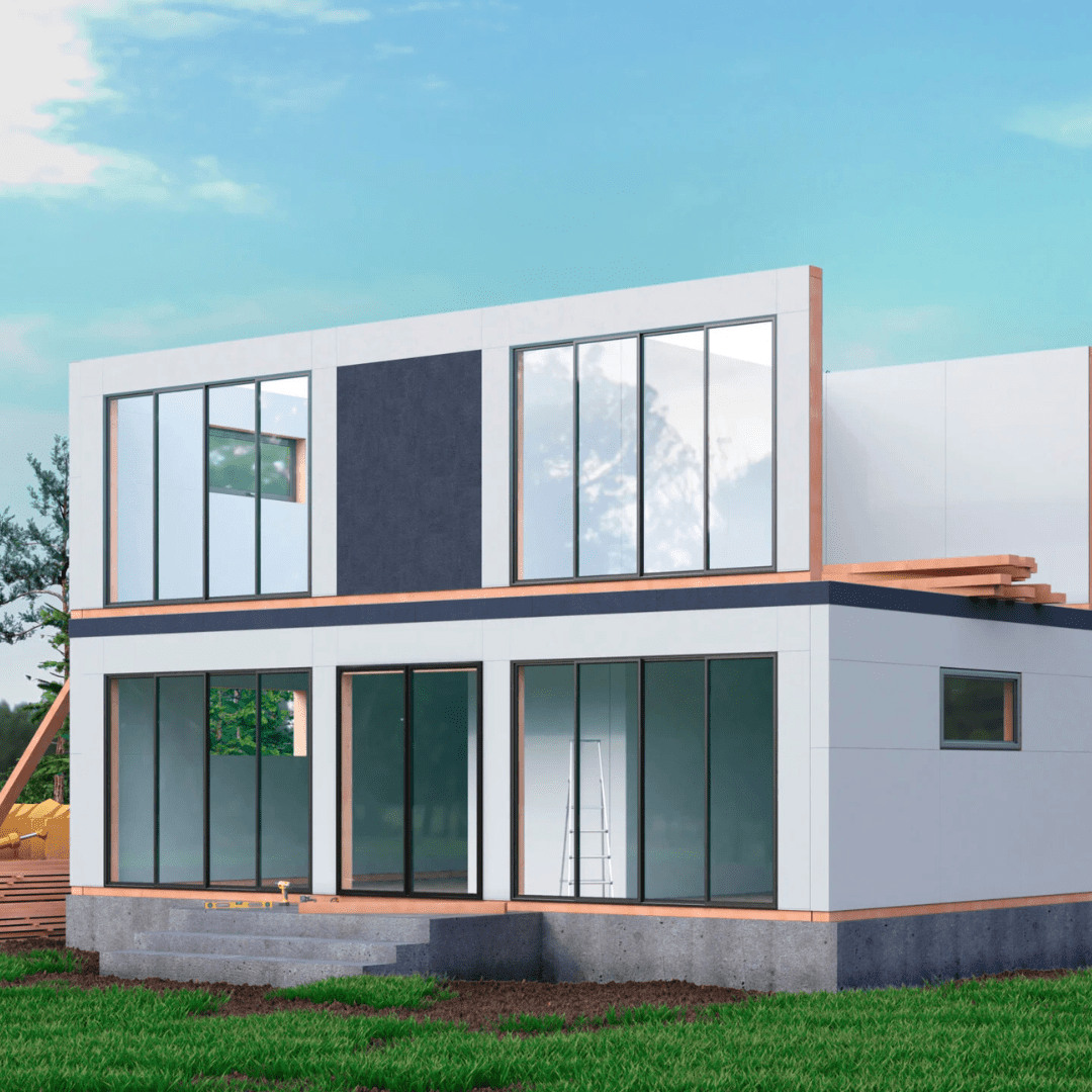 A modern two-story house under construction showcases large reflective windows and minimalist design, epitomizing the fast construction modular offices trend. A ladder leans against the exterior, set against a grassy plot and clear blue sky.