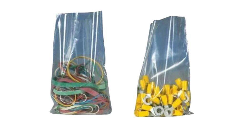Two transparent, versatile polyethylene bags are featured. The bag on the left contains colorful rubber bands, while the one on the right holds yellow and white cable connectors—an ideal example of economical packaging solutions for diverse needs.