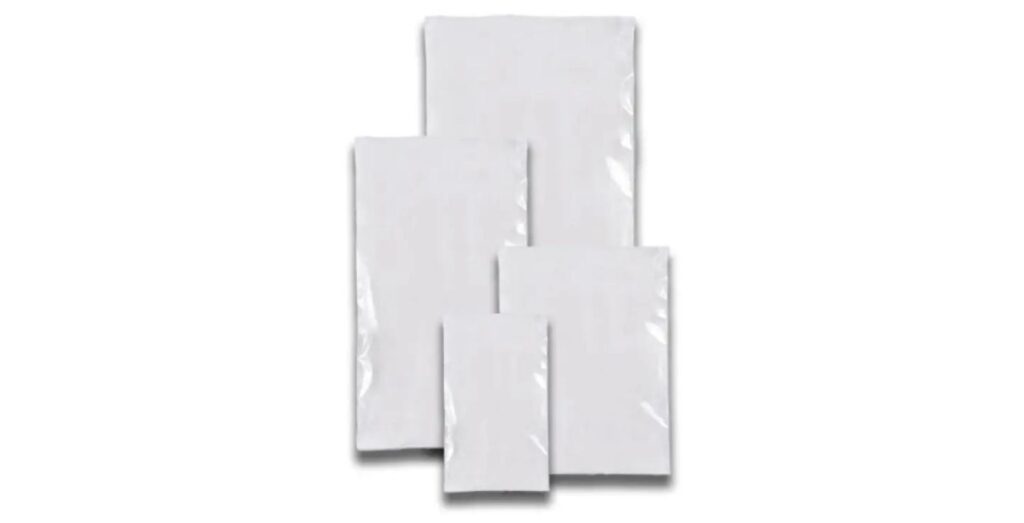 Four white, rectangular polyethylene bags of varying sizes=