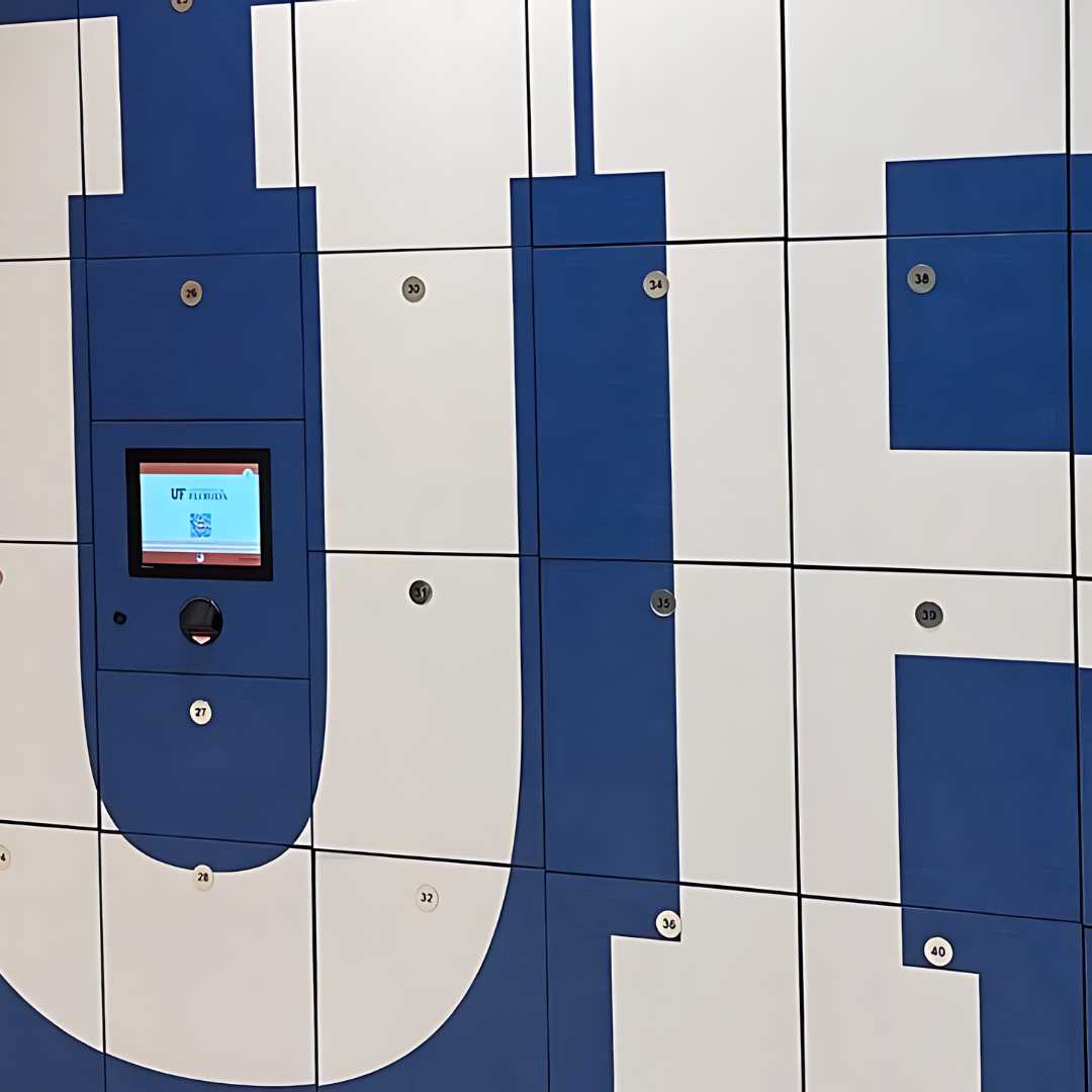A wall of parcel lockers boasting a sleek blue and white color scheme, highlighted by a central digital screen that effortlessly displays essential information.