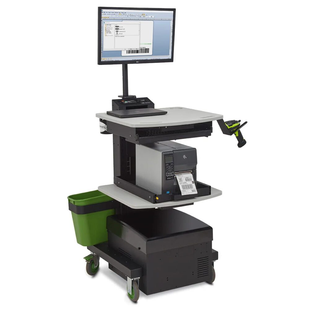 Powered cart featuring a computer monitor, keyboard, barcode scanner, and printer on three shelves. The middle shelf has a green waste bin attached, and theres a computer tower at the bottom. The cart glides smoothly on green caster wheels.