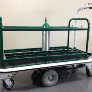 The Pony Express Motorized Medical Cylinder Cart, made by Electro Kinetic Technologies, includes a coated rack that securely holds 32 cylinders. It is painted green and white and stands on a gray floor against a beige wall.