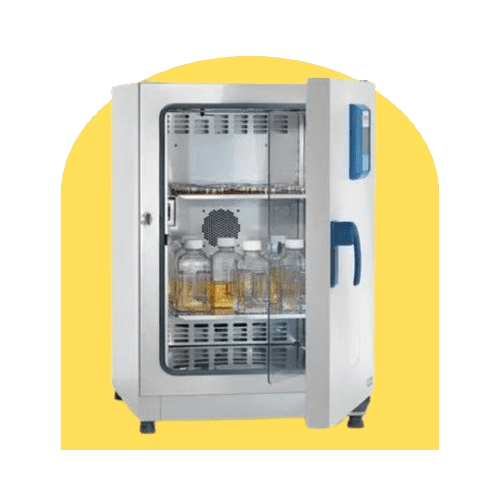 A microbiology incubator with a transparent door slightly ajar reveals shelves lined with bottles. The white unit, accented in blue, stands out against the yellow background.