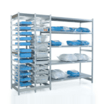 Metal storage shelves with organized wire baskets hold neatly folded blue and white cloth items, possibly linens or uniforms, in a clean and sterile healthcare environment.