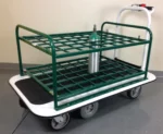 The Pony Express Motorized Medical Cylinder Cart, by Electro Kinetic Technologies, secures a medical oxygen tank on its green coated rack. Resting on a gray tiled floor against an off-white wall, this innovative cart holds 48 cylinders to advance healthcare mobility solutions.