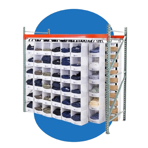 A metal shelving unit with multiple compartments showcases folded clothes like shirts and pants, enhanced by Warehouse Efficiency Improvements. The background features a blue circle, while cardboard boxes rest on a side shelf.