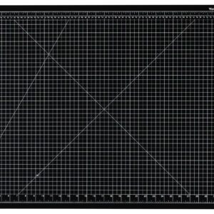 The Dahle Vantage® Premium Self-Healing Cutting Mat, 24 x 36, Black (Case of 8), features a white grid pattern with measurement markings in centimeters and inches, plus diagonal lines for angle precision.