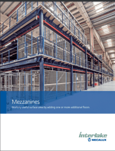 Industrial warehouse with metal mezzanines and shelving, featuring a high ceiling and bright lighting. The bottom has a blue overlay with text and logo for Interlake Mecalux.