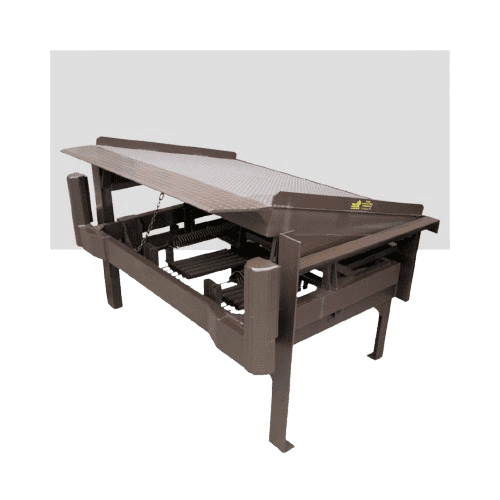 Brown industrial machinery with a tilted metal platform and sturdy legs, designed for handling materials. It includes a chain and cylindrical components, set against a plain white background.
