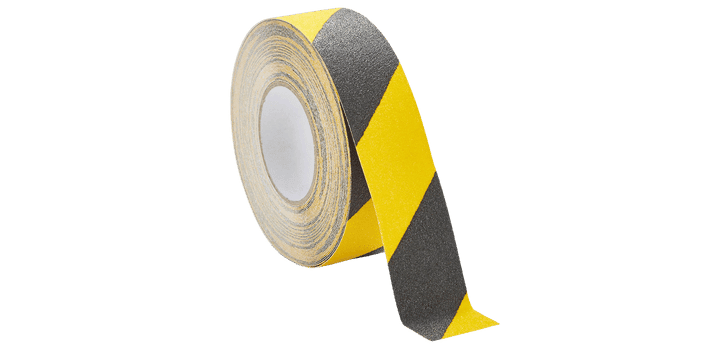 A vital tool for warehouse organization and safety, this roll of adhesive tape features alternating yellow and black diagonal stripes, partially unrolled.
