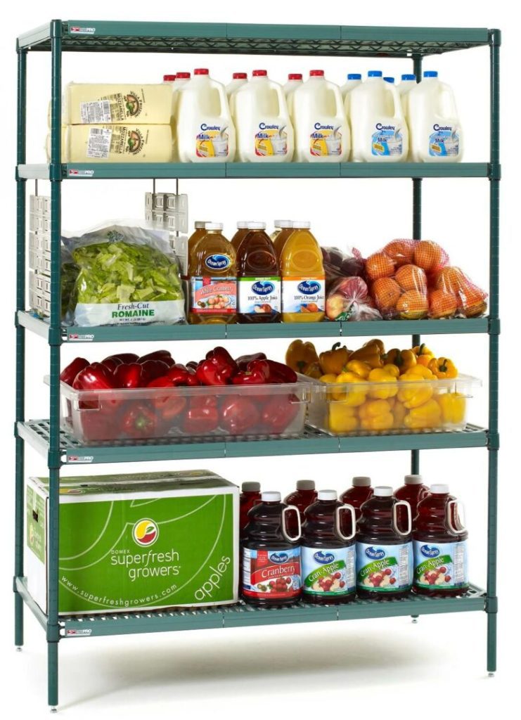 A metal shelving unit, courtesy of Supermarket Solutions, is stocked with gallon milk jugs, lettuce, juice bottles, apples, vibrant red and yellow bell peppers, and a box marked Superfresh Growers Apples on the bottom shelf.
