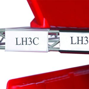 The sleek chrome-finish metal shelves hold red plastic containers with two Quantum Label Holders, 3, in gray, labeled LH3C and LH3B, adding elegance and functionality to the organized storage solution.