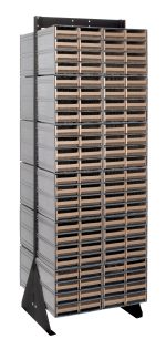 The Quantum Interlocking Storage Cabinets Floor Stand is a double-sided unit with a black coated finish and 14-gauge steel. Measuring 24D x 23-5/8W x 75H, it includes 24 QIC-83 drawers for organizing materials and features a sturdy base with a load capacity of 750 lbs.