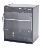 The Quantum Tip Out Bin has 1 compartment with a handle and label slot. Its clear plastic container opens to a 45° angle and is mounted in a polystyrene gray cabinet. Made in the USA, its designed for efficient storage and display on walls or countertops.