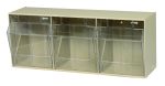 The Quantum Tip Out Bin features three compartments, each with a handle and label slot, clear plastic containers that open to a 45° angle within an ivory polystyrene cabinet. This product is ideal for organizing items at home or in the office and is proudly made in the USA.