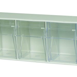 The Quantum Tip Out Bin features a polystyrene white cabinet with five clear compartments that open to a 45° angle. Each compartment includes handles with label slots for easy organization, making it ideal for neatly arranging small items. Made in the USA.