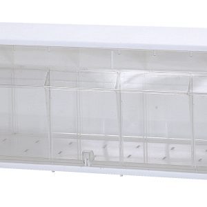 The Quantum Dividable Tip Out Bin, a polystyrene white cabinet with a clear plastic compartment, measures 23-5/8W x 5-1/4D x 5-15/16H and opens to a 45° angle for efficient small item organization on walls or flat surfaces.