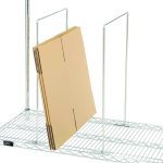 The Quantum Wire Carton Divider, measuring 18W x 14H with a chrome-plated finish, is designed for use with 18D wire shelves. It efficiently holds flat, folded cardboard boxes upright against its grid backdrop, and the minimalist style is enhanced by a plain white background.