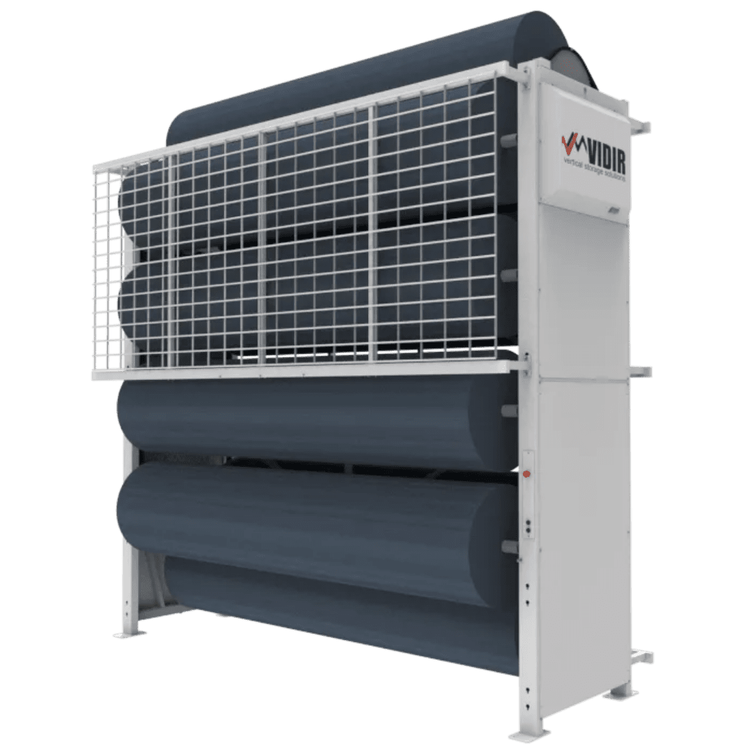 A large, vertical Vidir Vertical Storage Solutions system with multiple horizontal rolls of material, enclosed by a white metal frame with a grid safety cover and labeled Vidir on the top right section, designed for efficient space optimization.