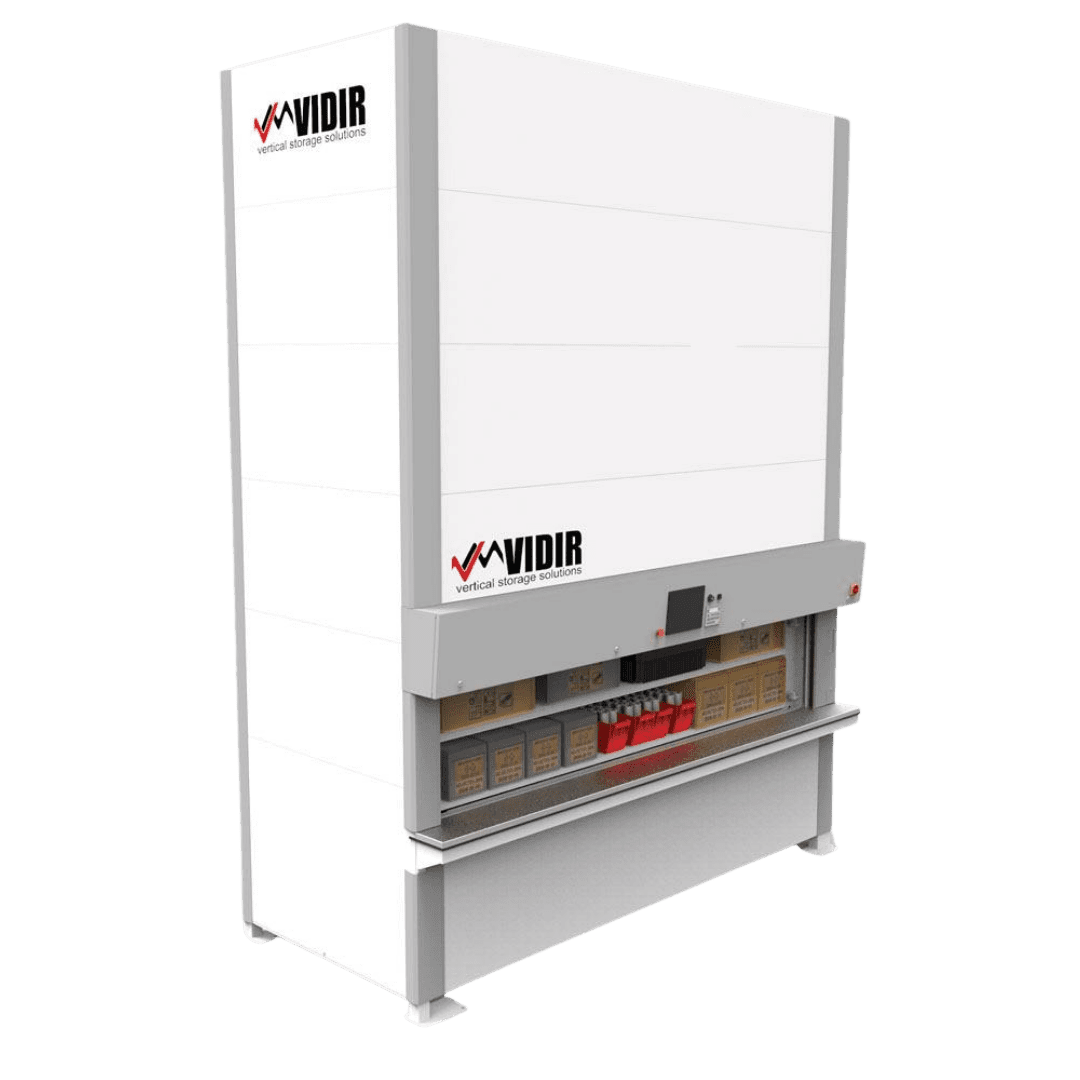 A tall, white Vidir Vertical Storage Solution stands labeled with shelves holding various boxes and a front control panel, exemplifying automated storage and space optimization systems.